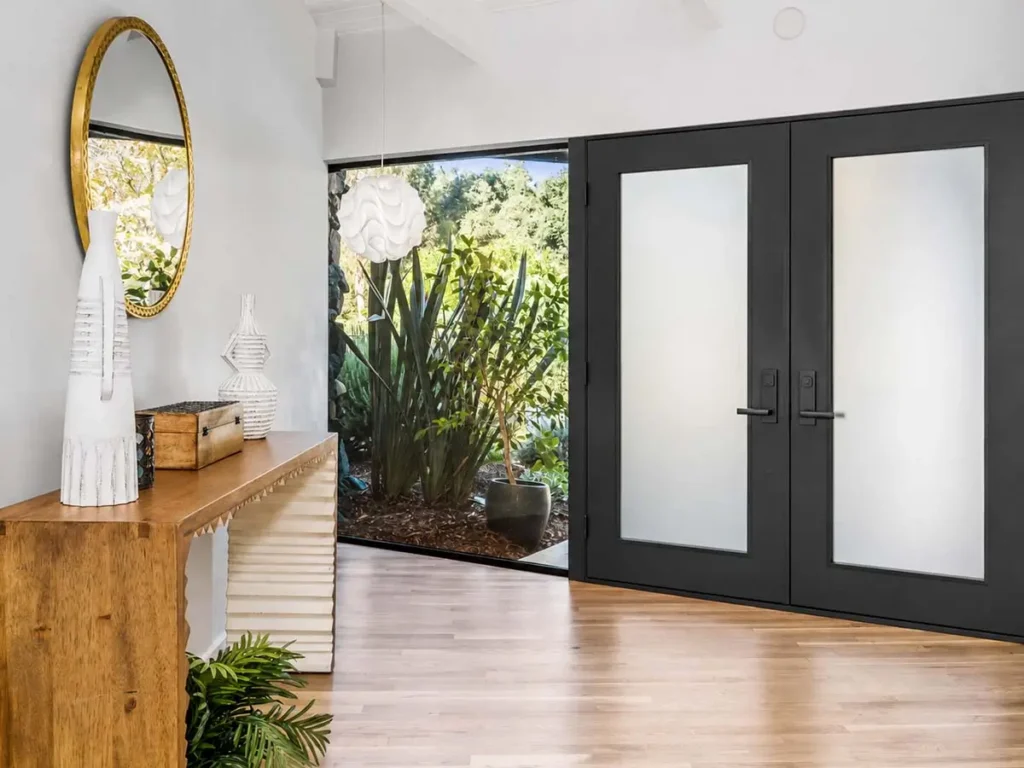 Door Replacement & Installation in East Valley featuring black fiberglass double doors with frosted glass.