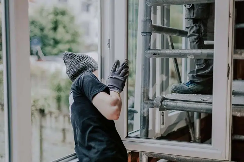 Signs you need to replace windows during professional installation of a new energy efficient window.